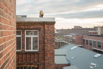 Das Stelzenhaus und die Konsumzentrale vom Westwerk aus gesehen.